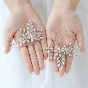 Pair of silver bridal hair pins with marquise cut crystals in a floral leaf design