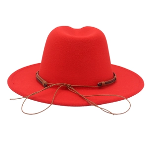 Close-up of red felt fedora hat featuring a brown braided rope band decoration