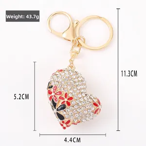 Detailed dimensions of heart keychain with crystal rhinestones and floral pattern