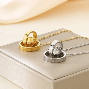 Minimalist interlocking double ring necklace with engraved moon and back quote in gold and silver