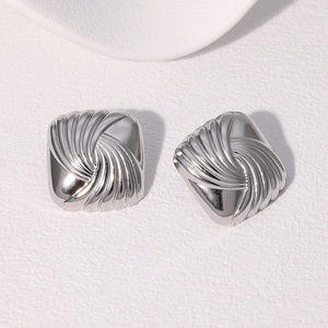 Silver square stainless steel earrings with spiral texture on a clean white background