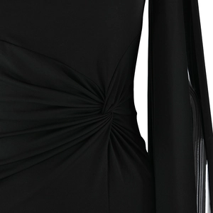 Close-up of elegant waist knot detail and draped fabric on black floor-length dress