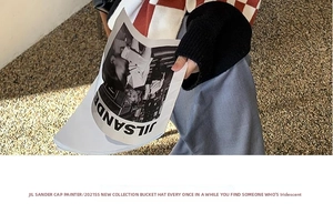 Detail of red and white checkerboard knit texture with stylish fashion magazine prop