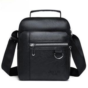 Detail of premium black PU leather bag with metal zipper and embossed logo branding