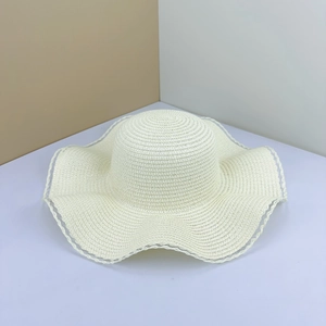 Creamy white wide brim straw hat with elegant wavy edges and detailed mesh weaving