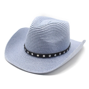 Close-up of light blue woven cowboy hat with black leather band and silver studs