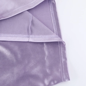 Detailed view of purple satin fabric with high-quality hem stitching and silky luster