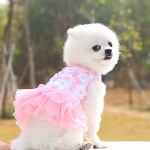 Detail of pink cherry blossom pet dress with 3D floral appliques and layered mesh skirt