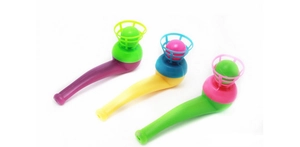 Macro detail of three colorful plastic floating ball pipe toys for kids' breathing exercise