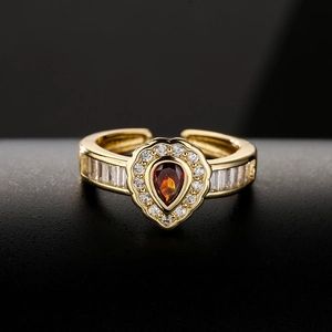 Vintage 18K gold teardrop ring with red pear-cut stone and pavé zircon accents