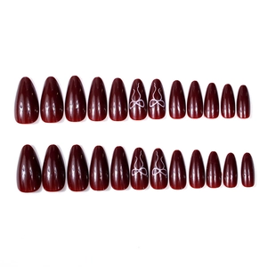 24pcs burgundy almond press-on nails featuring white bow designs and glossy finish