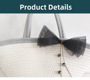 Close-up of woven tote bag with gray handle and decorative black mesh bow detail
