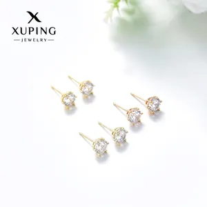 Detail of three pairs of gold-plated stud earrings with square cubic zirconia in 4-prong setting