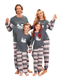 Close-up of snowman family print and festive deer patterns on Christmas pajamas