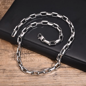 Men's silver hip hop stainless steel rectangular box chain necklace on wooden surface