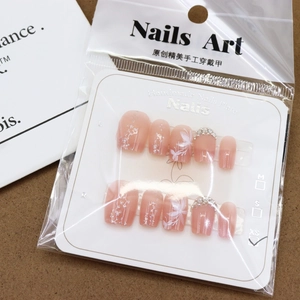 Pink jelly press-on nails set with floral patterns and pearl rhinestones, size XS