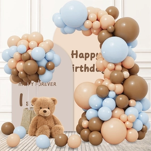 Detail of blue and brown balloon arch with teddy bear and Happy Birthday backdrop