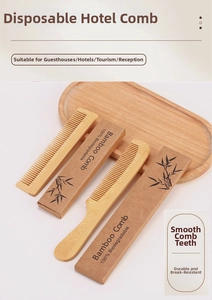 Biodegradable bamboo comb set in eco-friendly paper packaging on wooden tray