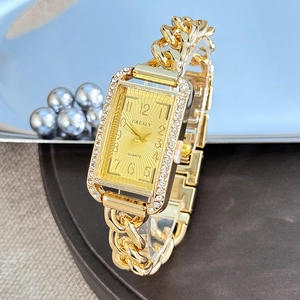 Luxurious gold rectangular watch with diamond-set bezel and chain link strap for women