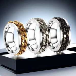 Close-up of rotatable chain rings in gold, silver and black stainless steel finishes