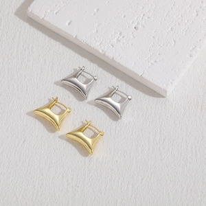 Minimalist geometric hoop earrings in gold and silver finish with a polished surface