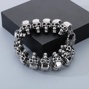Macro shot of punk style skull link bracelet in vintage stainless steel with bone clasp