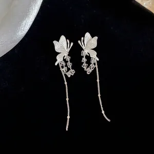 Elegant silver butterfly tassel earrings with crystal accents and sleek brushed finish