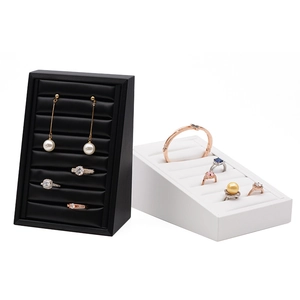 Elegant black and white leather jewelry display stands for rings and earrings