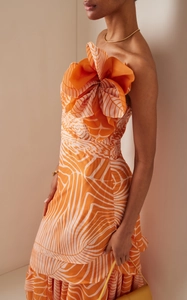 Detail of 3D origami-style flower and orange leaf pattern on a designer bikini set