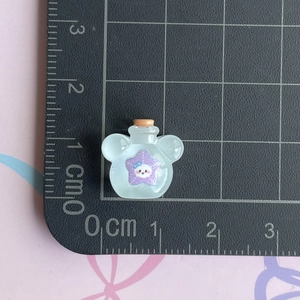 Mini Mickey-shaped drift bottle resin charm with purple star detail on measuring mat