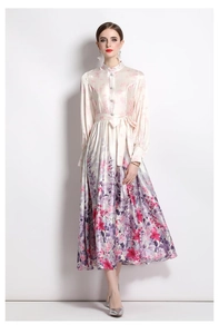 Close-up of satin floral dress with lantern sleeves and elegant mandarin collar