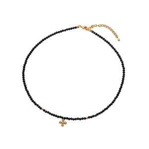 Minimalist black beaded choker necklace with a dainty gold cross pendant and adjustable chain