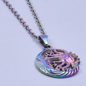 Detailed macro view of iridescent sun and moon pendant on stainless steel chain