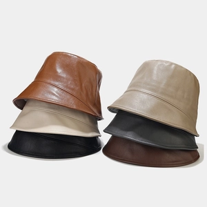Japanese style minimalist PU leather bucket hats in six colors on light grey background