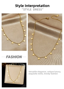 Detail view of a gold-plated stainless steel necklace with heart pendants in a gift box