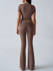 Rear view of brown short sleeve top and flared trousers set in slim fit design