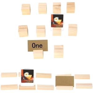 Multiple natural wood block card holders in cube and rectangular shapes on white background