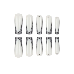 French tip press-on nails in long coffin shape with black glitter and silver rhinestones