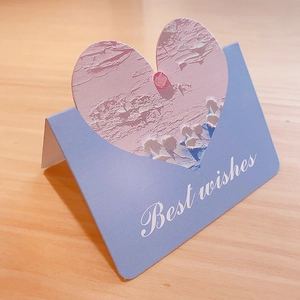 Detail of 3D oil painting heart card with 'Best wishes' text on a light blue card holder