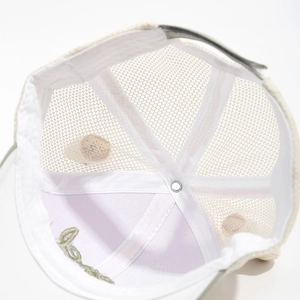 Close-up of kids mesh baseball cap interior showing breathable fabric and green embroidery