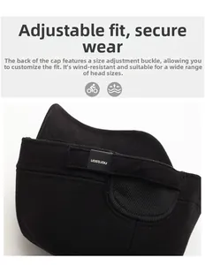Detail of adjustable metal buckle and twill fabric texture on warm black flat cap