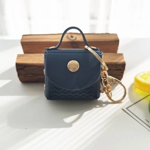 Mini navy blue PU leather coin purse keychain with wave stitching and gold hardware