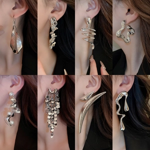 Detailed collection of silver irregular geometric pearl earrings shown on models