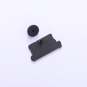 Detail showing matte black metal pin back structure and secure rubber clutch closure