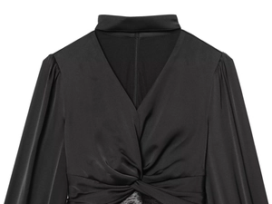 Detail of black satin blouse with V-neck knot design and hidden back zipper