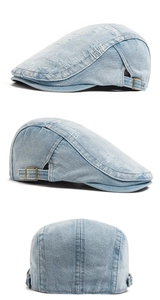 Detailed side view of washed blue denim beret with vintage copper adjustment buckle
