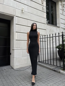 Elegant sleeveless turtleneck black knit maxi dress with slim fit ribbed texture