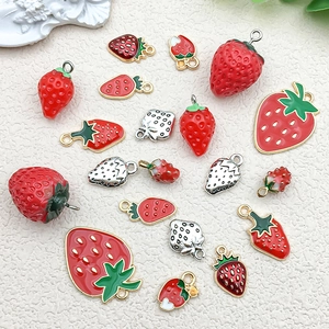 Assorted mini 3D strawberry alloy charms for DIY jewelry making in vibrant red and green