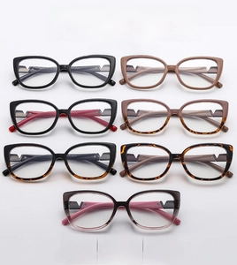 Detail of stylish cat eye glasses frames with metal V-shaped accents in multiple colors