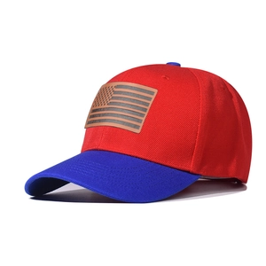 Detail view of two-tone baseball cap with American flag patch in red and blue twill